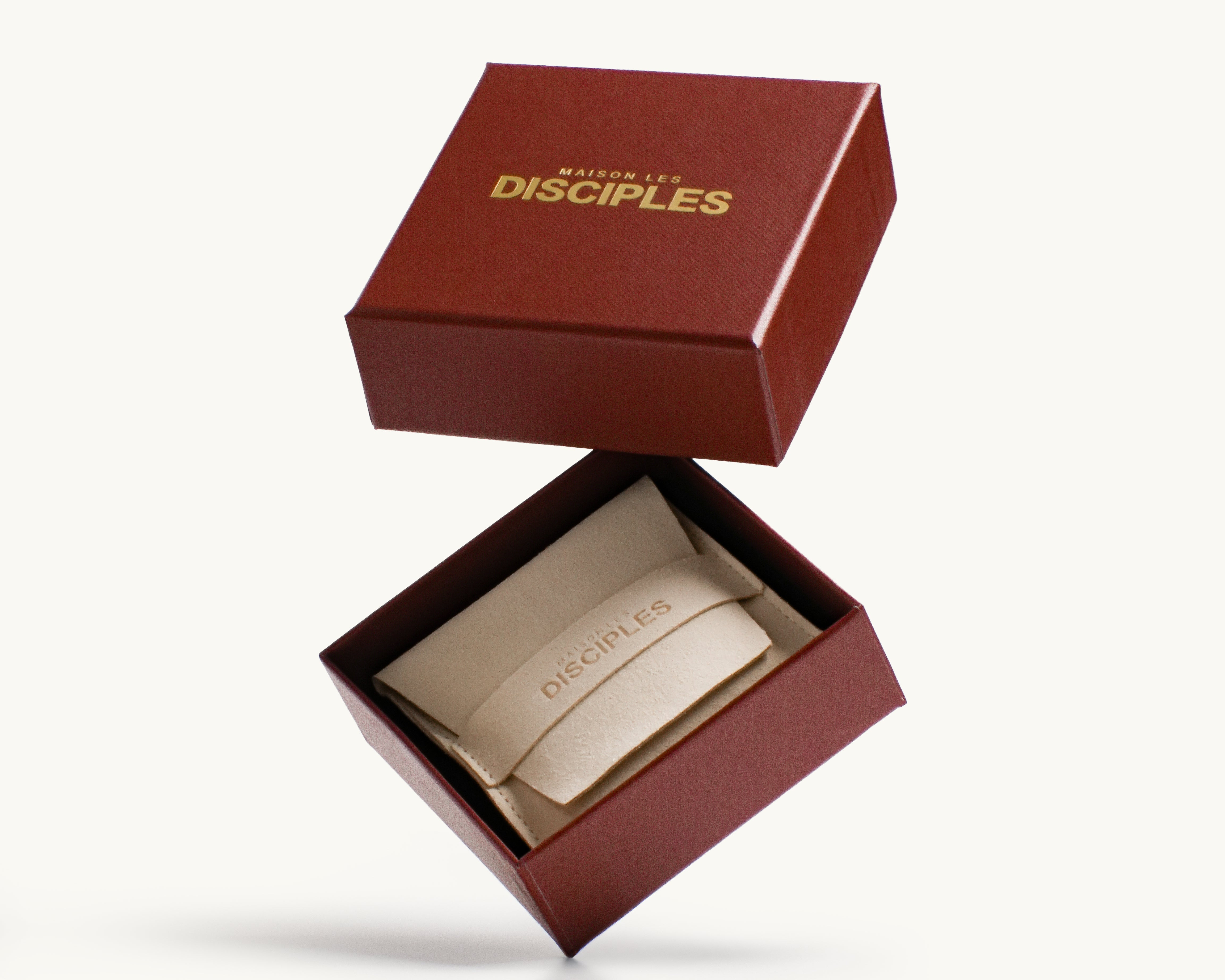 Maison Les Disciples product in a red box on a white background